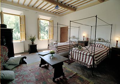 A bedroom of Villa Ballati in the park of Castello di Grotti near Siena