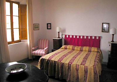A bedroom of Villa Ballati in the park of Castello di Grotti near Siena